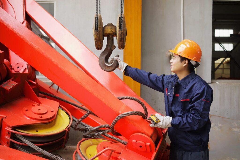 Home 8 worker using equipment in crane manufacturing facility china